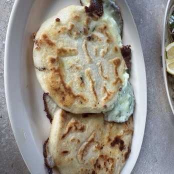 Rinconcito Salvadoreno - Cheese and jalapeño pupusa on top, chicken and cheese pupusa on bottom - Salvadoran Near Me - Vallejo, California Rinconcito Salvadoreno - Cheese and jalapeño pupusa on top, chicken and cheese pupusa on bottom - Salvadoran Near Me - Vallejo, California