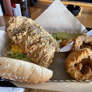 Snuffy's Bar & Grill - Fried chicken sandwich with onion rings - Bars Near Me - Hutto, Texas Snuffy's Bar & Grill - Fried chicken sandwich with onion rings - Bars Near Me - Hutto, Texas