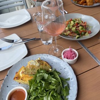 District Winery - Frittata and tomato cucumber salad and pampelmous rose - Wineries Near Me - Washington, DC, District of Columbia District Winery - Frittata and tomato cucumber salad and pampelmous rose - Wineries Near Me - Washington, DC, District of Columbia