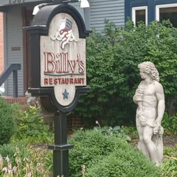 a statue in front of a restaurant