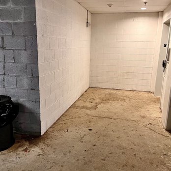 Eastside Flats - Dirty and Dingy residents entrance. Stained concrete, trash, dust and whatever else oozed out of the trash can- Welcome Home ! - Apartments Near Me - Malvern, Pennsylvania
