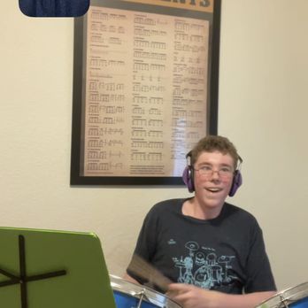 Drum Lessons with Chip Ritter - Chip Ritter with Liam Kincaid who is rocking out during his Virtual Drum Lesson - Musical Instruments & Teachers Near Me - Tucson, Arizona