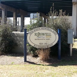 Sign at intersection of Old Alabama and Riverside Road, next to parking under GA400 Sign at intersection of Old Alabama and Riverside Road, next to parking under GA400