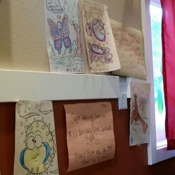 Mina's Cafe - Coloring book pages on the wall from appreciative guests - Thai Near Me - Salem, Oregon Mina's Cafe - Coloring book pages on the wall from appreciative guests - Thai Near Me - Salem, Oregon