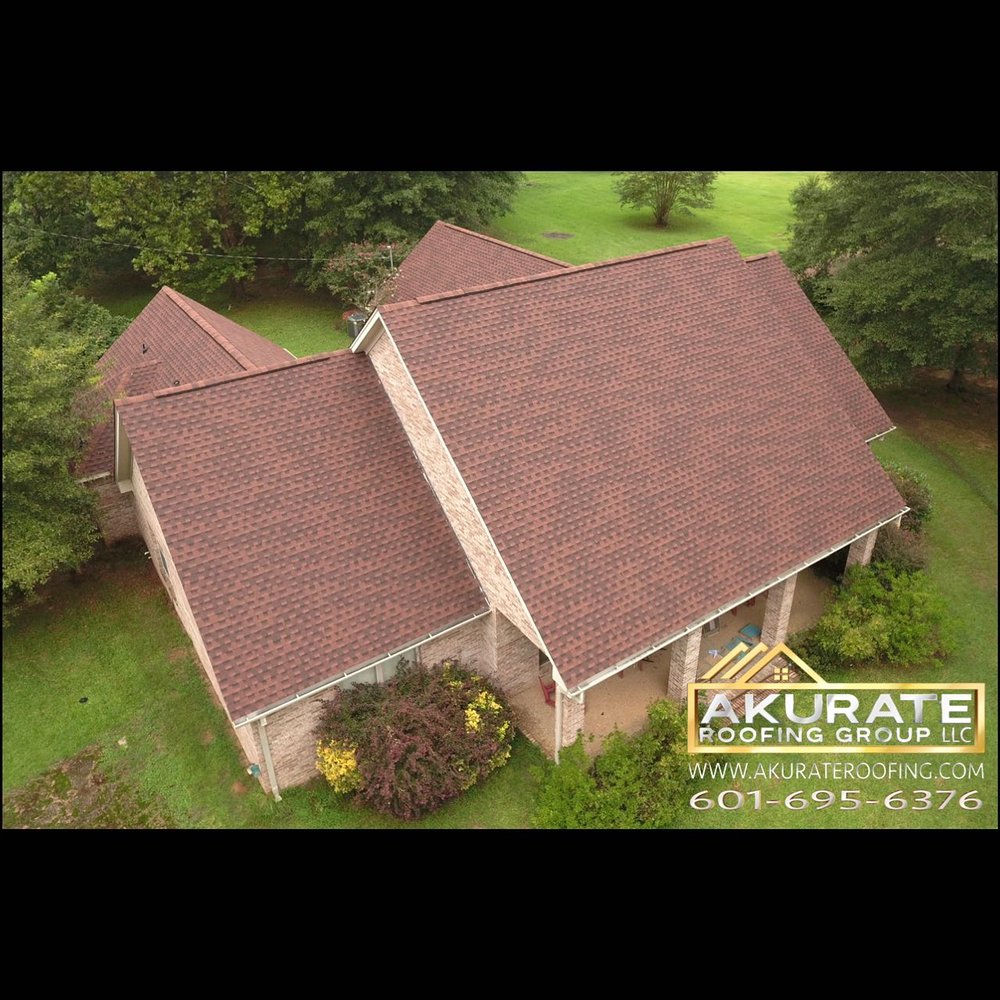 Slide of Akurate Roofing Group