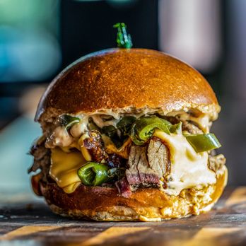 The Bone Shop - Jalapeño cheddar brisket burger - Food Delivery Services Near Me The Bone Shop - Jalapeño cheddar brisket burger - Food Delivery Services Near Me