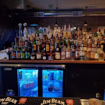 John Henry’s - a bar filled with liquor bottles - Bars Near Me - Tucson, Arizona
