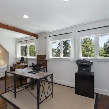 Timberwolf Construction - a home office with a desk and a printer - General Contractors Near Me Timberwolf Construction - a home office with a desk and a printer - General Contractors Near Me