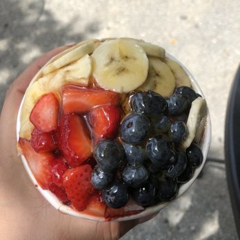 Press Blend Squeeze - a hand holding a bowl of fruit - Juice Bars & Smoothies Near Me - Peachtree Corners, Georgia Press Blend Squeeze - a hand holding a bowl of fruit - Juice Bars & Smoothies Near Me - Peachtree Corners, Georgia