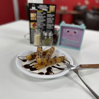 Daisy’s Pizza - a plate of bananas and chocolate sauce - Pizza Near Me - Atlanta, Georgia