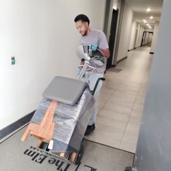 Small Move Same Day - Apartment move with furniture safely transported through an interior hallway using professional equipment.