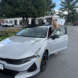 Hart Motors - My wife taking delivery of one of the many cars we have purchased from Hart motor company.