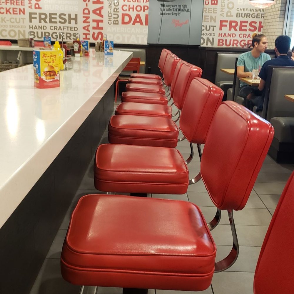 Johnny Rockets - Sitting at the counter.  Great comfy chairs. - Burgers Near Me - Tempe, Arizona
