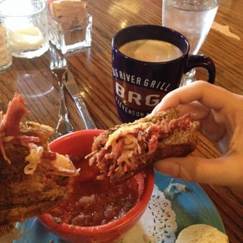 Big River Grill - A delicious Rueben sandwich being dipped in tomato basil soup with hot cocoa on the side! - American Near Me - Stevenson, Washington