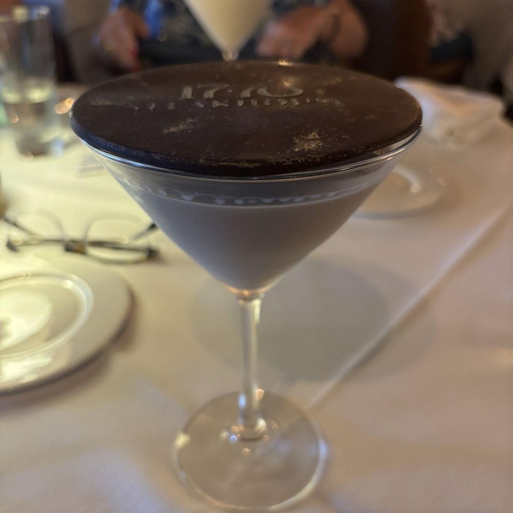 1776 Steakhouse - Chocolate martini with in-house chocolate disc lid stenciled in edible gold dust. Please start selling the disc lids to go - fabulous. - Steakhouses Near Me - Rehoboth Beach, Delaware 1776 Steakhouse - Chocolate martini with in-house chocolate disc lid stenciled in edible gold dust. Please start selling the disc lids to go - fabulous. - Steakhouses Near Me - Rehoboth Beach, Delaware