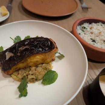 Eylan - Charred Black Cod - $45 Cured in tamarind, curry leaves, turmeric, kohlrabi poriyal & coconut rice - Indian Near Me - Menlo Park, California Eylan - Charred Black Cod - $45 Cured in tamarind, curry leaves, turmeric, kohlrabi poriyal & coconut rice - Indian Near Me - Menlo Park, California