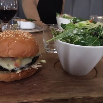 Cure Lounge & Patio - Portobello mushroom burger and salad . Really good veggie option - Lounges Near Me - Whistler, British Columbia