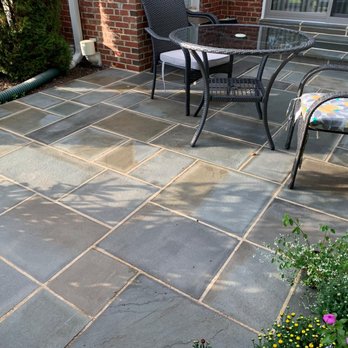 Alarcon's Landscaping - a patio with chairs and a table - Landscaping Near Me