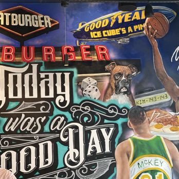 Fatburger & Buffalo's Express - I couldn't get the entire mural without taking pictures of patrons; but there's a painting of Ice Cube on the left (unseen) - Burgers Near Me - Los Angeles, California Fatburger & Buffalo's Express - I couldn't get the entire mural without taking pictures of patrons; but there's a painting of Ice Cube on the left (unseen) - Burgers Near Me - Los Angeles, California