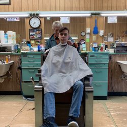 Hixson Barber Shop - Tommy keeping my teenager perfectly happy with his hair!