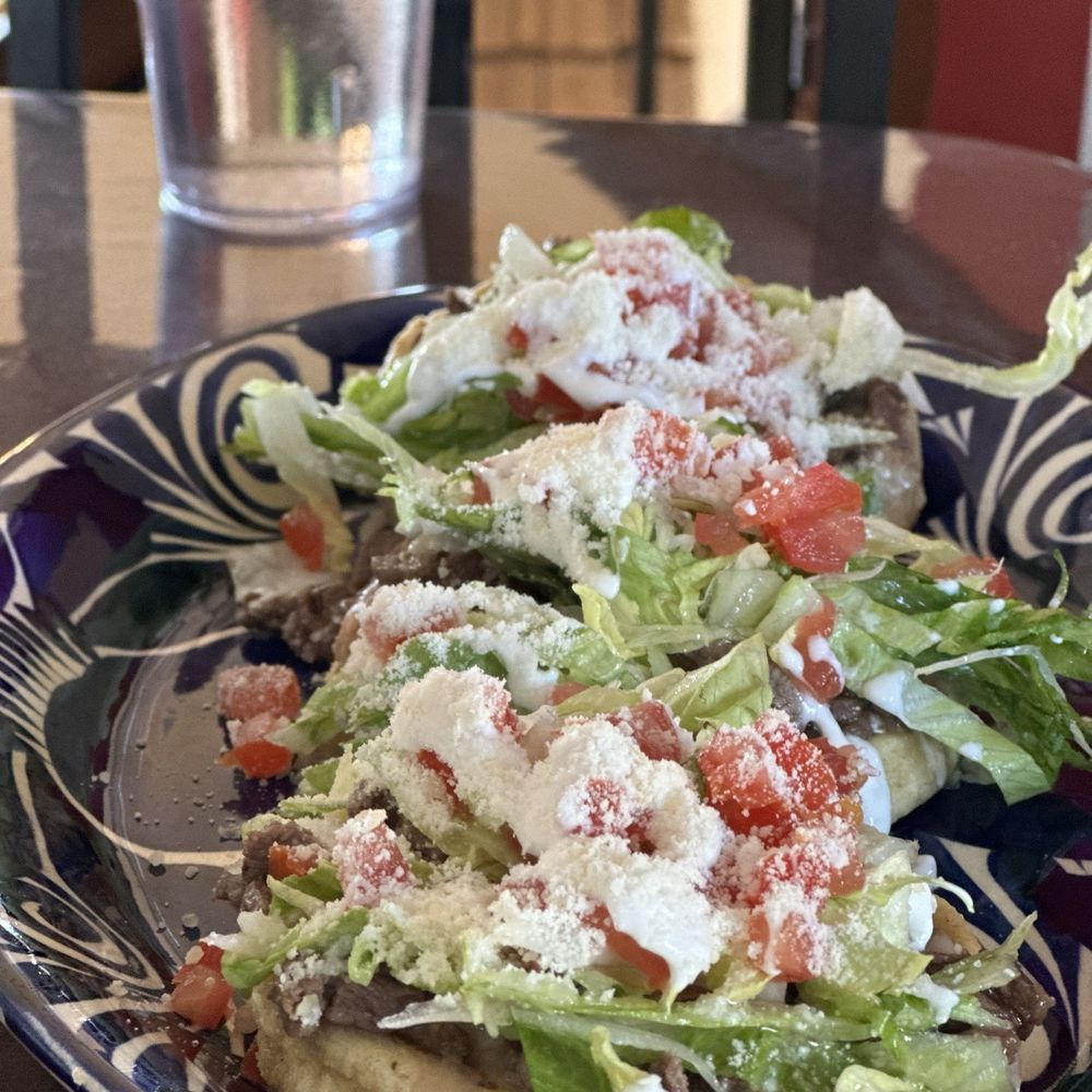 El Tio Chuy - Carne asada sopes with lettuce, tomatoes, Mexican crema and cotija cheese. - Mexican Near Me - Klamath Falls, Oregon El Tio Chuy - Carne asada sopes with lettuce, tomatoes, Mexican crema and cotija cheese. - Mexican Near Me - Klamath Falls, Oregon