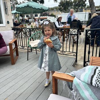 Jedidiah Coffee - Gated off area and my daughter devouring a yummy croissant - Coffee & Tea Near Me - Laguna Beach, California