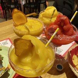 3 mango margaritas and a strawberry one