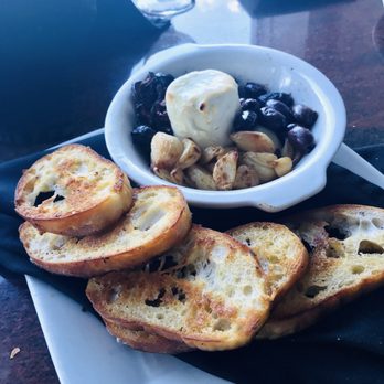Azure Oceanfront Dining - Nothing small about their goat cheese app. It had roasted garlic cloves, olives and sun dried tomatoes....outstanding and plenty for 2. - Seafood Near Me - Daytona Beach Shores, Florida