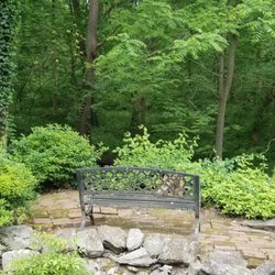 The Hollinger House - Hollinger House Grounds - a pretty little seating area with a creek running by.