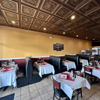 Bombay Bites - a dining area with tables and chairs - Indian Near Me - Centreville, Virginia Bombay Bites - a dining area with tables and chairs - Indian Near Me - Centreville, Virginia