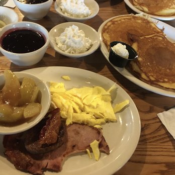 Cracker Barrel Old Country Store - Pancakes with blackberry sauce, sausage, ham, scrambled eggs, and cinnamon apples. - American Near Me - Olathe, Kansas