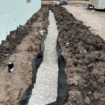 Lone Star Repair Pros - a drainage system being installed - General Contractors Near Me