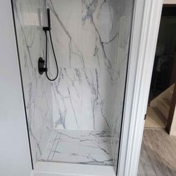 Me and My Van Home Repair - Customer shower - porcelain tile shower with custom glass door and black fixtures