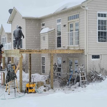 Atlas Carpentry - two men standing on a deck in the snow - Decks & Railing Near Me - Akron, Ohio Atlas Carpentry - two men standing on a deck in the snow - Decks & Railing Near Me - Akron, Ohio
