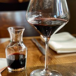True Kitchen + Bar - A glass of Malbec