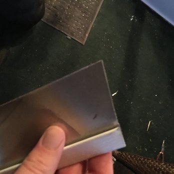 Superior Siding & Windows - a hand holding a piece of aluminum - Windows Installation Near Me Superior Siding & Windows - a hand holding a piece of aluminum - Windows Installation Near Me