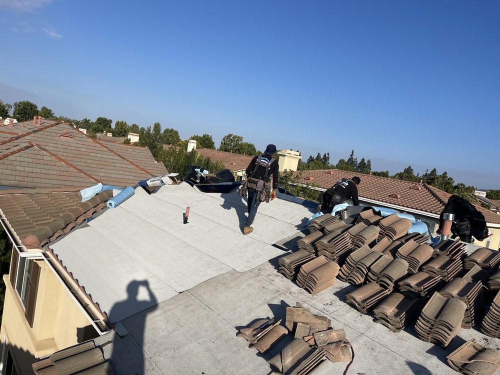 Slide of Rudy’s roofing