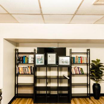 Oasis Taproom - a living room with a bookshelf and chairs - Beer Bar Near Me - Pittsburgh, Pennsylvania Oasis Taproom - a living room with a bookshelf and chairs - Beer Bar Near Me - Pittsburgh, Pennsylvania