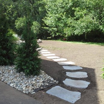Ray's Lawnworks & Landscaping - a stone path in a garden - Landscaping Near Me - Glastonbury, Connecticut Ray's Lawnworks & Landscaping - a stone path in a garden - Landscaping Near Me - Glastonbury, Connecticut