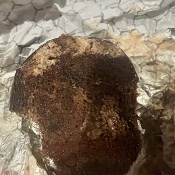 Boombox Bar - Ordered DoorDash and that's the burnt bun on my burger. Hard as a hockey puck. - Salad Near Me - Seattle, Washington