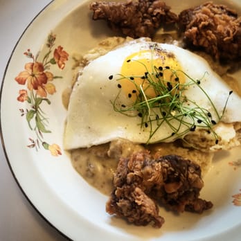 Milktooth - Sweet tea fried chicken, biscuits, sausage gravy, sunny side up egg. - Breakfast & Brunch Near Me - Indianapolis, Indiana Milktooth - Sweet tea fried chicken, biscuits, sausage gravy, sunny side up egg. - Breakfast & Brunch Near Me - Indianapolis, Indiana
