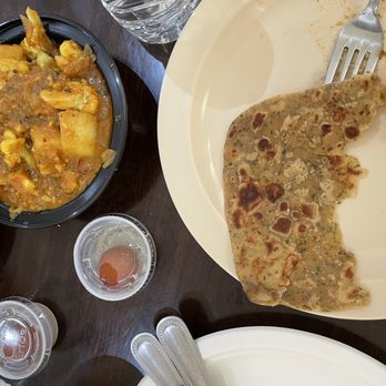Bawarchi Indian Restaurant - Aloo Gobi on the left and naan - Indian Near Me - Wilmington, Delaware Bawarchi Indian Restaurant - Aloo Gobi on the left and naan - Indian Near Me - Wilmington, Delaware