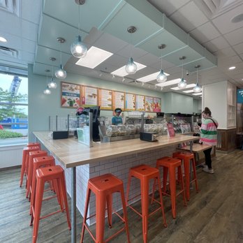 Tropical Smoothie Cafe - a woman sitting at the counter - Juice Bars & Smoothies Near Me - Glendale, Wisconsin Tropical Smoothie Cafe - a woman sitting at the counter - Juice Bars & Smoothies Near Me - Glendale, Wisconsin