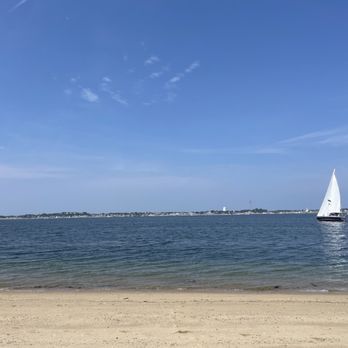 Provincetown Causeway - Nearly empty beach with a sailboat cruising by (near the long point lighthouse) - Hiking Near Me - Provincetown, Massachusetts