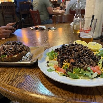 Hoot's BBQ - Beef brisket on baked potato - Barbeque Near Me - McGehee, Arkansas Hoot's BBQ - Beef brisket on baked potato - Barbeque Near Me - McGehee, Arkansas