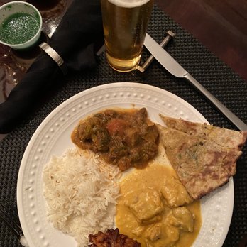 Indian Garden - Starting at top then clockwise: Goat Curry, 2 types of Bread, Chicken Korma, Onion Bhajiya & Basmati Rice - Indian Near Me - Yardley, Pennsylvania Indian Garden - Starting at top then clockwise: Goat Curry, 2 types of Bread, Chicken Korma, Onion Bhajiya & Basmati Rice - Indian Near Me - Yardley, Pennsylvania