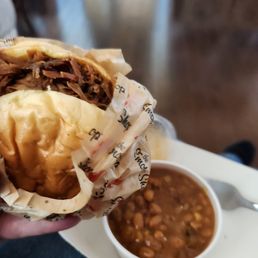 Pulled pork sandwich and baked beans Pulled pork sandwich and baked beans