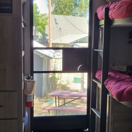 The view from our doorway looking outside. Junky. Who wants to sit outside looking at this??