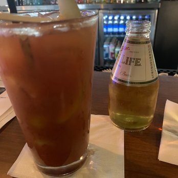 The Holiday Bar - Bloody Mary (missing the cheese and meat because I it has been consumed) and yes that is a mini Miller High Life. - Pubs Near Me - Grand Rapids, Michigan The Holiday Bar - Bloody Mary (missing the cheese and meat because I it has been consumed) and yes that is a mini Miller High Life. - Pubs Near Me - Grand Rapids, Michigan