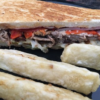 Guava Tree Cafe - Cubano with a side of yuca fries and I added caramelized onions and roasted red peppers - Latin American Near Me - Albuquerque, New Mexico